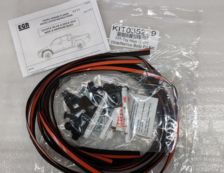 EGR Fender Flares Fitting Kit for Toyota Hilux, showing mounting hardware, seals, and installation components for secure flare fitment