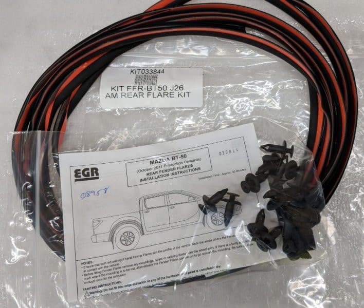 Mazda BT-50 2011–2017 EGR Fender Flares Fitting Kit, displaying fasteners, rubber edging, and components for secure flare attachment