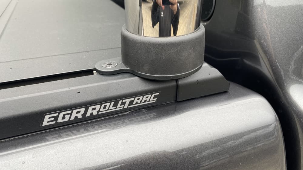 LDV T60 fitted with EGR RollTrac Sports Bar Adapter Kit, close-up showing black powder-coated adapter bracket mounted to RollTrac rail