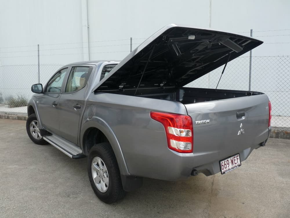 Side profile of Mitsubishi Triton MQ/MR with EGR 3 Piece Hard Lid, showing low-profile ABS construction and secure coverage