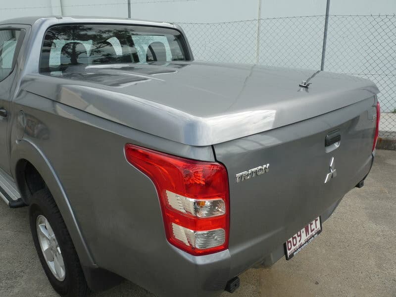 Rear view of Mitsubishi Triton MQ/MR with EGR 3 Piece Hard Lid, featuring push-button lock and tight tub sealing