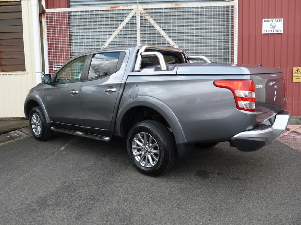 Mitsubishi Triton MQ/MR front three-quarter view with EGR 3 Piece Hard Lid installed, emphasizing factory-style appearance and rugged functionality