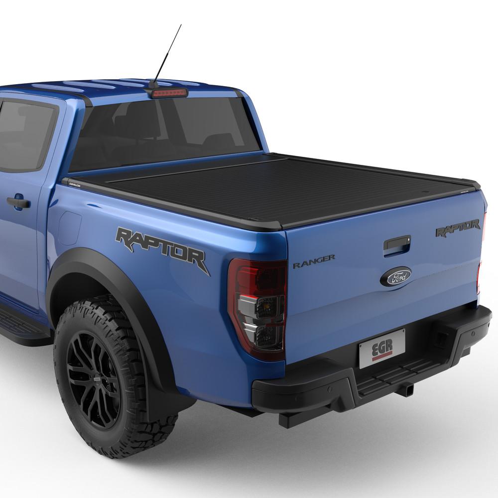 Ford Raptor fitted with EGR RollTrac Electric E3, rear three-quarter view showing low-profile electric roller cover and rugged styling
