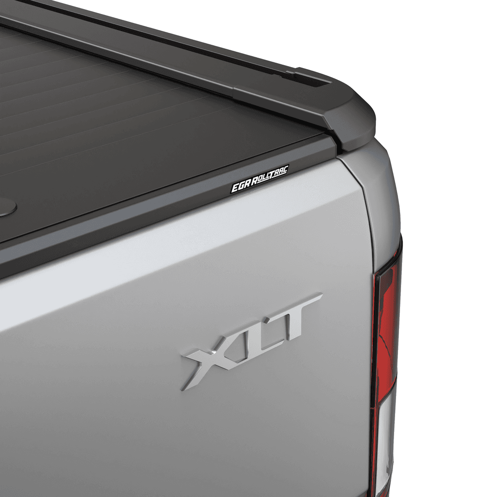 Close-up of EGR RollTrac Electric E3 matte-black aluminium slats on Ford Ranger tailgate, showing premium finish and sealing