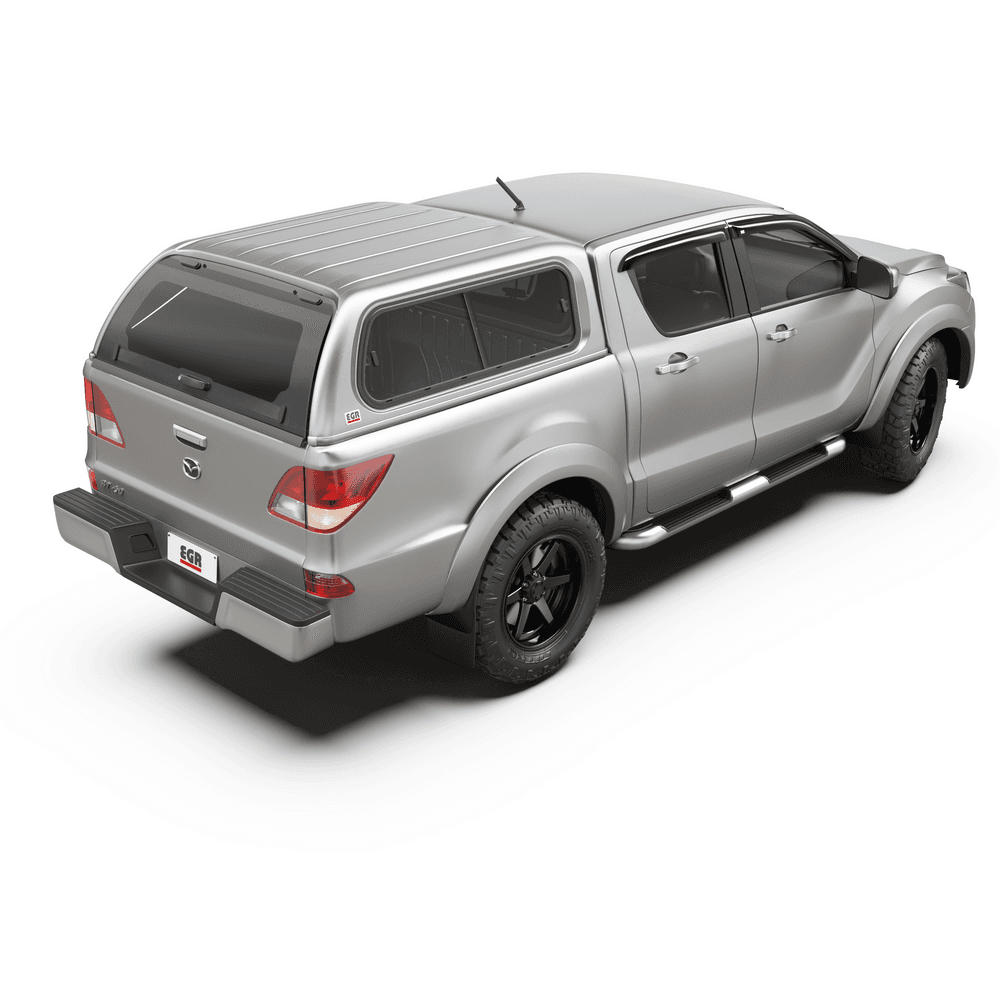 Rear angle of a Mazda BT-50 showcasing the EGR Premium Canopy with tinted frameless windows and lift-up rear access