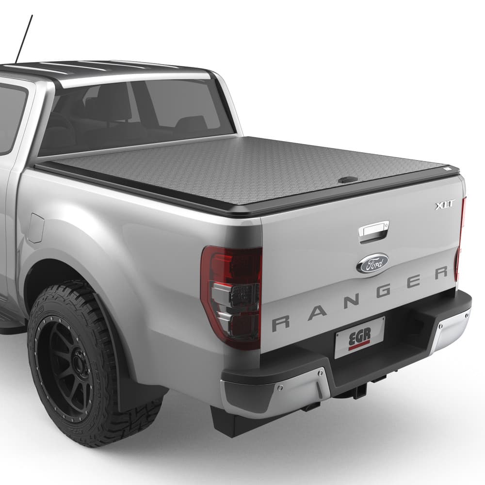 Side view of a Ford Ranger PX highlighting the EGR Load Shield’s matte black checker-plate surface