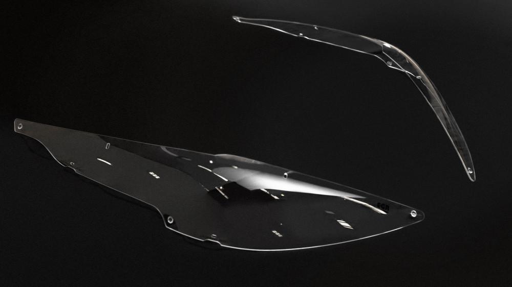 Dark smoke weather shield on Nissan Navara window for rain and wind protection