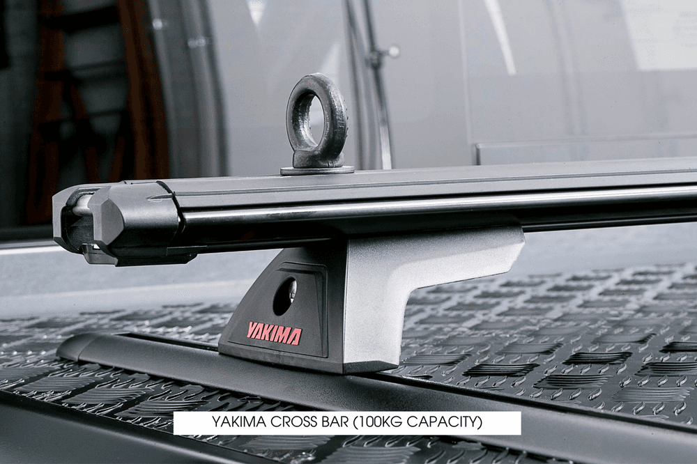 Side view of Yakima Cross Bar Kit installed on EGR Load Shield hard lid