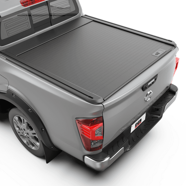 EGR RollTrac Manual roller tonneau cover fitted to Nissan Navara 2021-onwards, showing low-profile aluminium slat design with tray fully covered