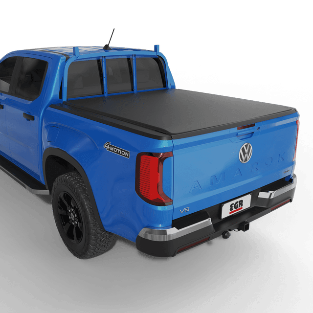 Volkswagen Amarok NF with EGR soft tonneau cover fitted, showing matte black low-profile tub cover from rear angle