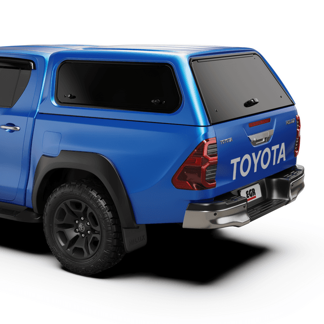 Rear three-quarter view of Toyota Hilux fitted with EGR Core Canopy, showing tinted rear window and OEM-style finish