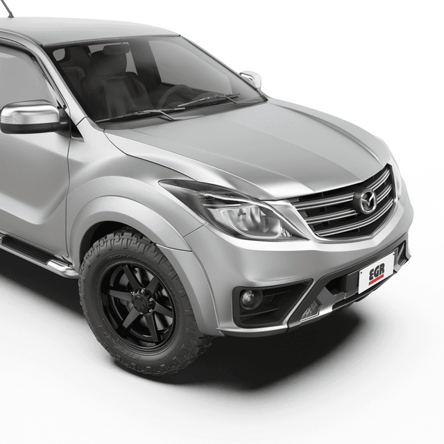 Front three-quarter view of a Mazda BT-50 with EGR Fender Flares installed, showcasing the rugged styling and enhanced wheel arch protection
