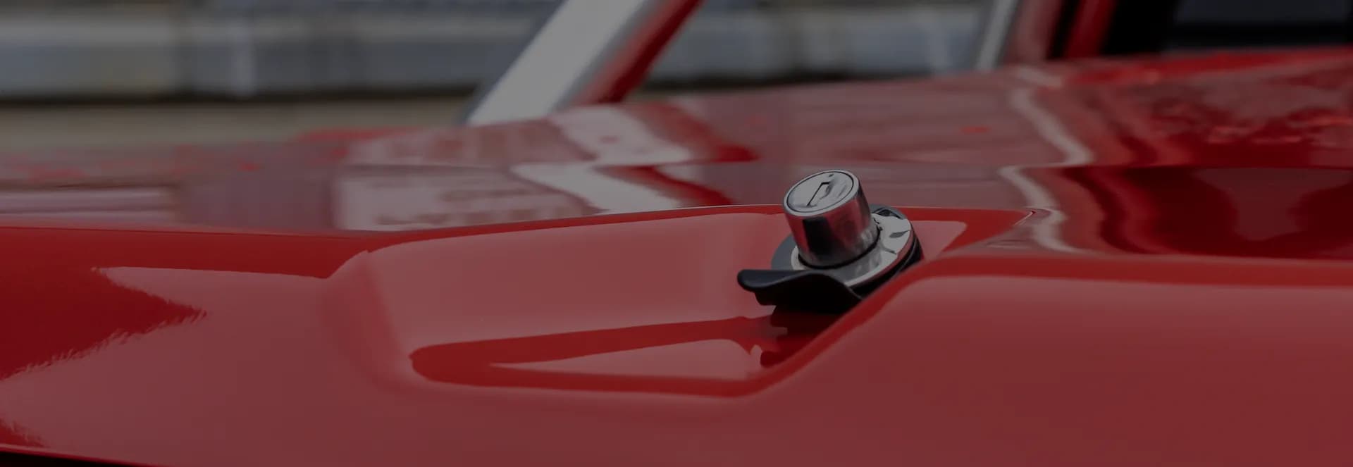ute driving on a dirt road around a field